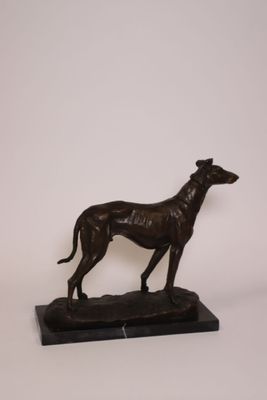 statue of a greyhound dog on a marble base on a white background