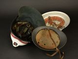 a helmet and a bowl on a black table