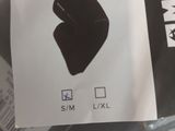 a picture of a pair of black gloves on a plastic bag