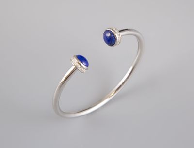 a white gold ring with lapis and diamonds