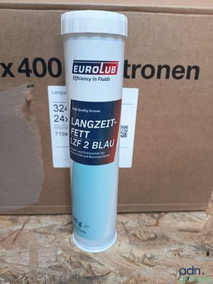 a box that has a bottle of blue paint on it