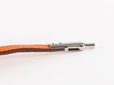 a pipe with a wooden handle on a white surface