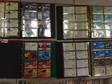 a lot of dvds and cds on the wall