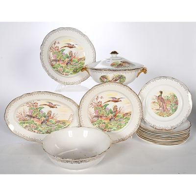 une photo représentant un ensemble d'assiettes et de bols en porcelaine posés sur une table