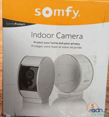 the box of the sony indoor camera is sitting on the floor