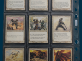 a lot of cards that are in a binder