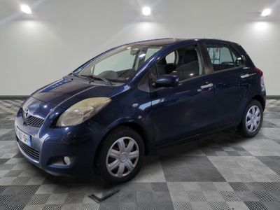 a picture of a blue car parked in a garage