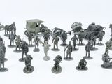 many figurines of different types and sizes on a white surface