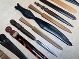 many different types of knives on the table