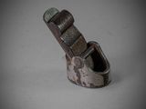 a close up of a metal buckle on a white surface