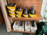 many boxes of shoes sitting on a shelf in a room