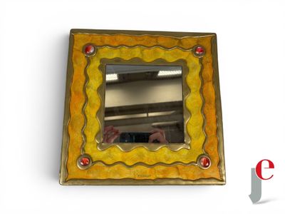 a picture of a mirror that is hanging on the wall