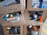 two cardboard boxes stacked on top of each other on the street