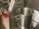 a large metal pot that is sitting in a kitchen