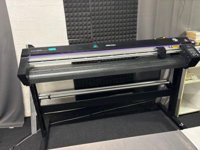 an image of a large ploter printer sitting on top of a table