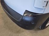 a close up of a car bumper with a sticker on it
