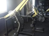 a gym room with a bench, weights, and other equipment
