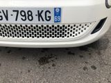 a white car that is parked in a parking lot