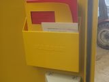a yellow mailbox with a fan attached to it