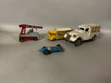 four toy cars that are sitting next to each other