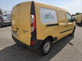 a yellow van that is parked in a parking lot