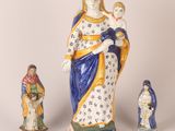 three figurines of the virgin mary and child jesus