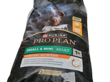 a bag of pro plan small and mini adult dry dog food on a white background