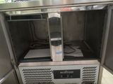 stainless steel counter top freezer with electronic controls in a kitchen