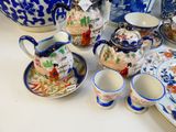 a table with a lot of blue and white dishes and cups
