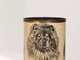a black and white image of a bear on a brown cup