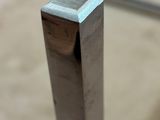 a close up of a piece of metal on a table