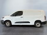 the white van is parked in a room with a gray floor