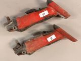 pair of red skis on a white surface
