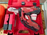 a red tool box with tools in it on a table