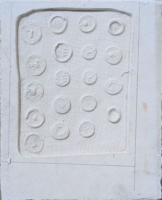 a picture of a white tile with circles and dots on it
