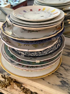 many plates stacked on top of each other on a table