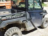 an image of a utility vehicle parked on the side of the road