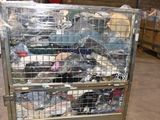 a metal cart with many items in it in a warehouse