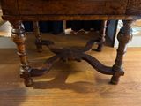 a wooden table with a drawer on it on a hard wood floor