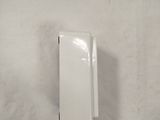 a small white box on the wall next to a toilet