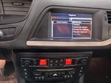 the dashboard of a car with a digital display in the center of it