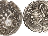 a silver coin with an image of a man on it