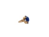 an image of a ring with a blue stone surrounded by diamonds