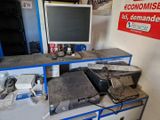 a desk with a computer and a printer on it
