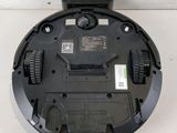 an image of a robotic vacuum cleaner sitting on top of a table