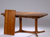 a wooden table with a small table top on it