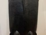 an image of a black vase sitting on top of a wooden table
