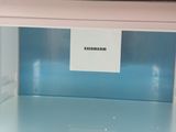 a microwave that has a sign on the top of it
