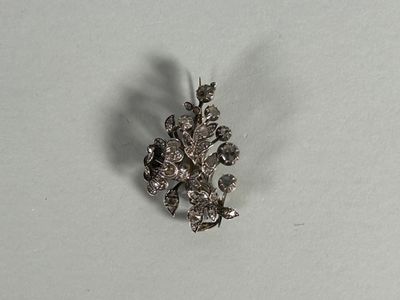 a small piece of jewelry that is laying on a table