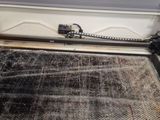 an image of a machine that is cutting a piece of fabric